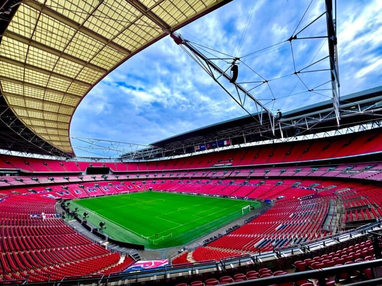 A stunning view of the iconic Wembley Stadium in London, capturing its vastness and architectural beauty.