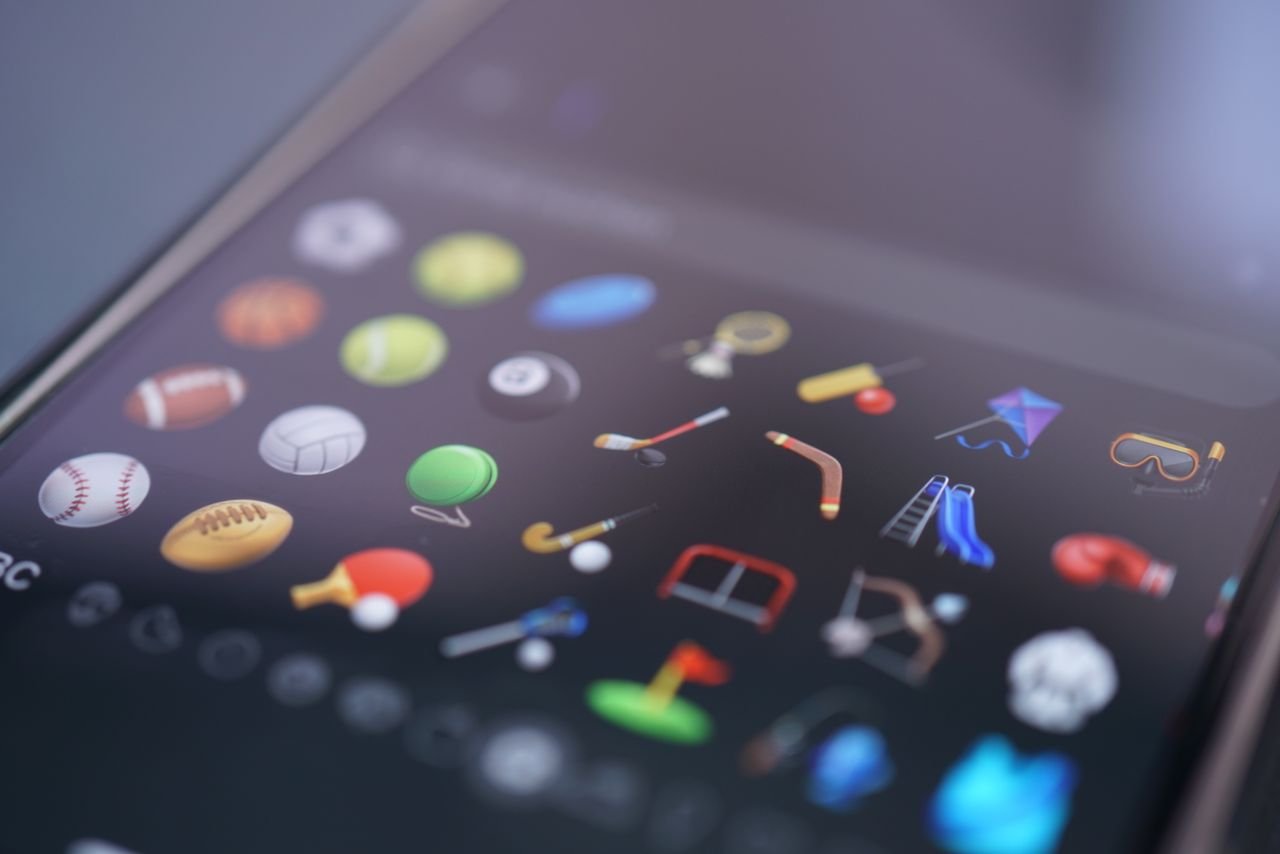 A detailed view of various sports-themed emojis displayed on a smartphone screen.